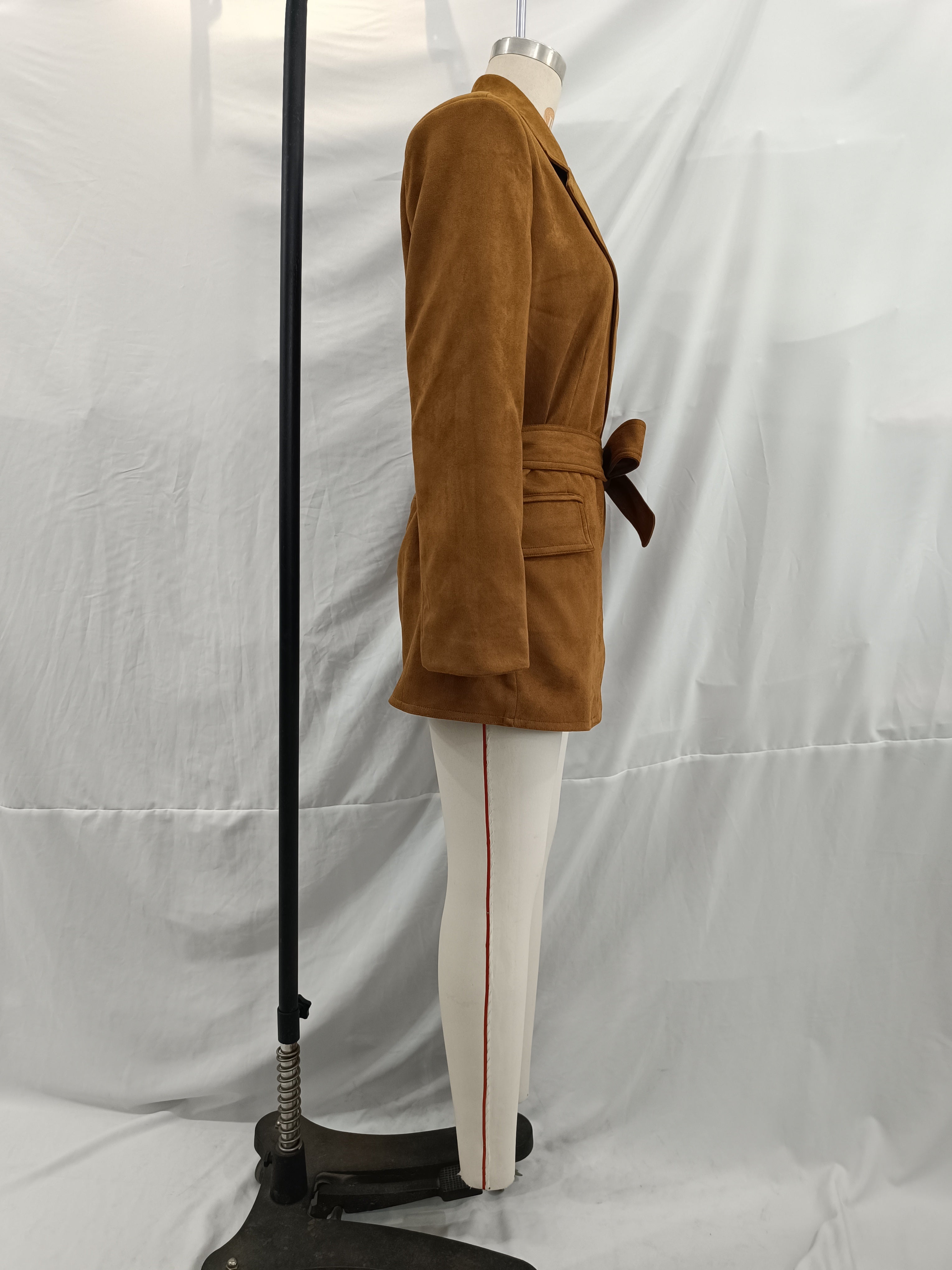 Elegant langry fashion suede blazer in brown corduroy with white pants and red stripe