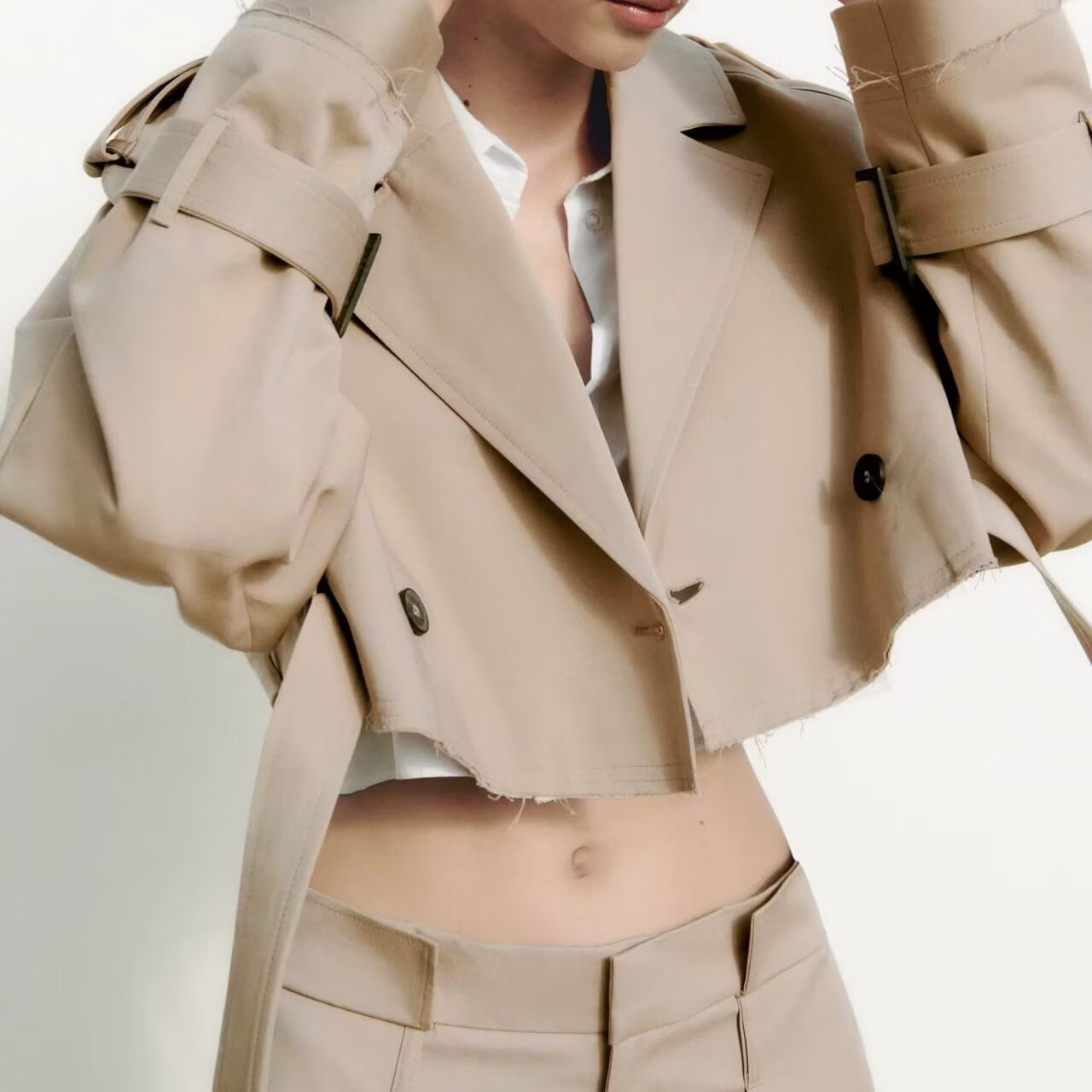 Beige double-breasted trench coat with black accents in Langry fashion