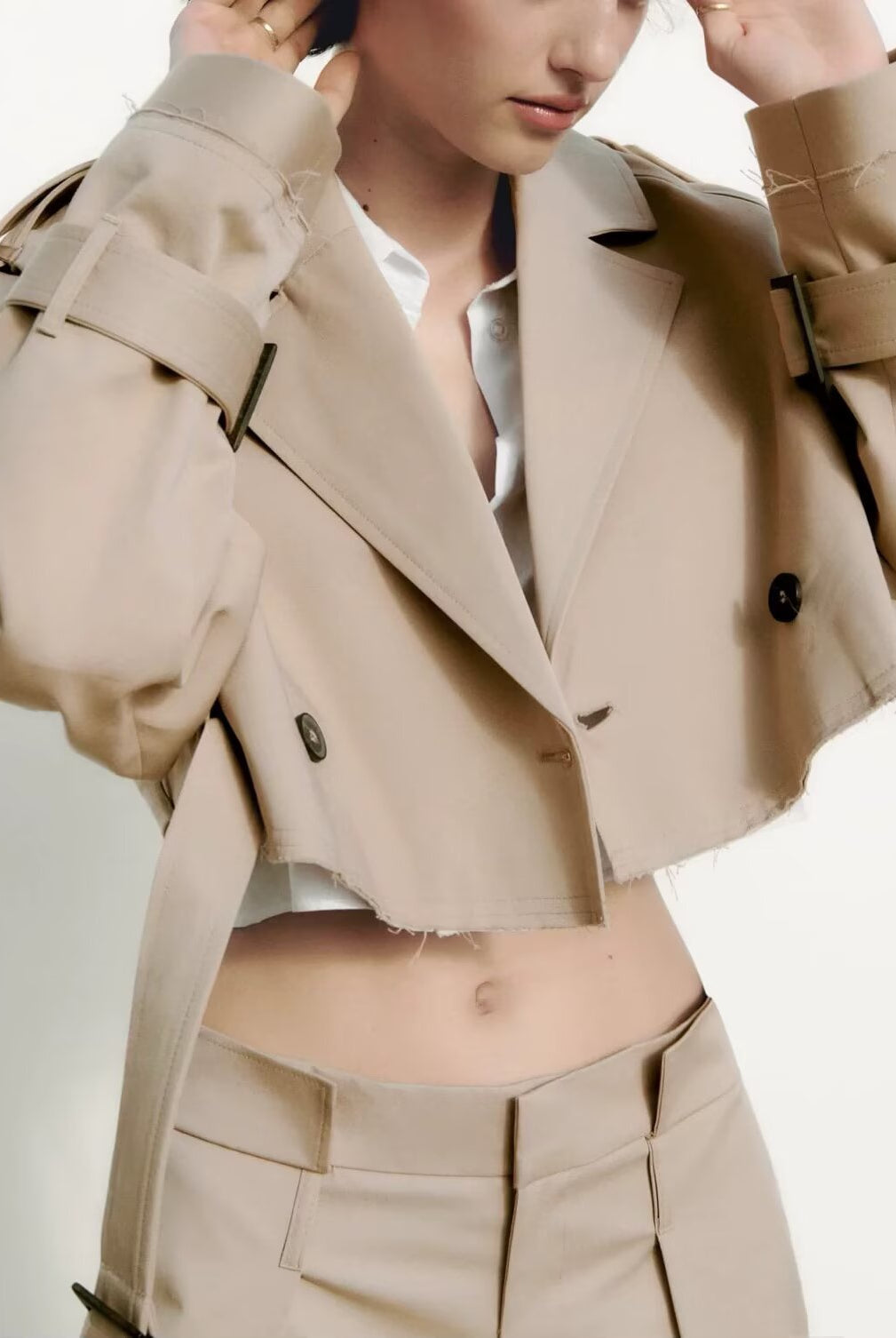 Beige double-breasted trench coat with black accents in Langry fashion