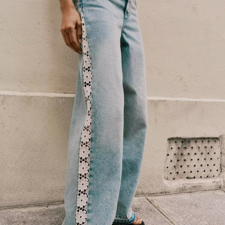 Light blue wide leg jeans with white floral embroidery and high waist