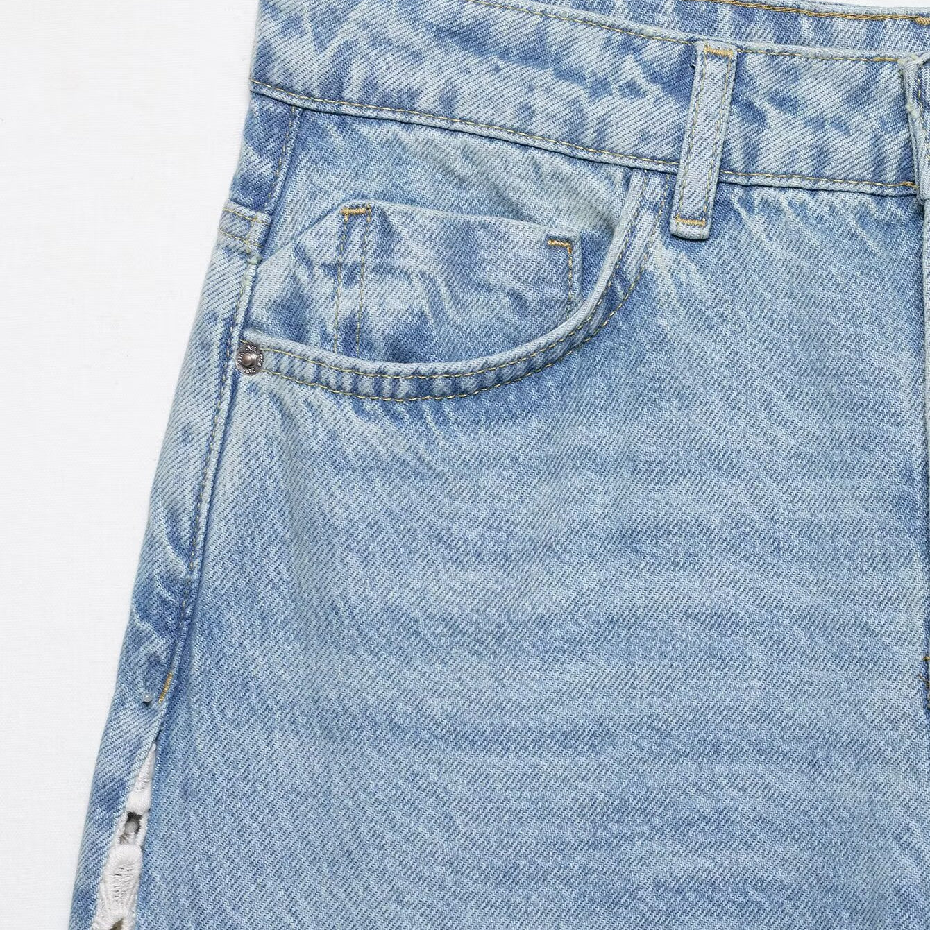 Light blue wide leg denim skirt with side zipper and pocket detail