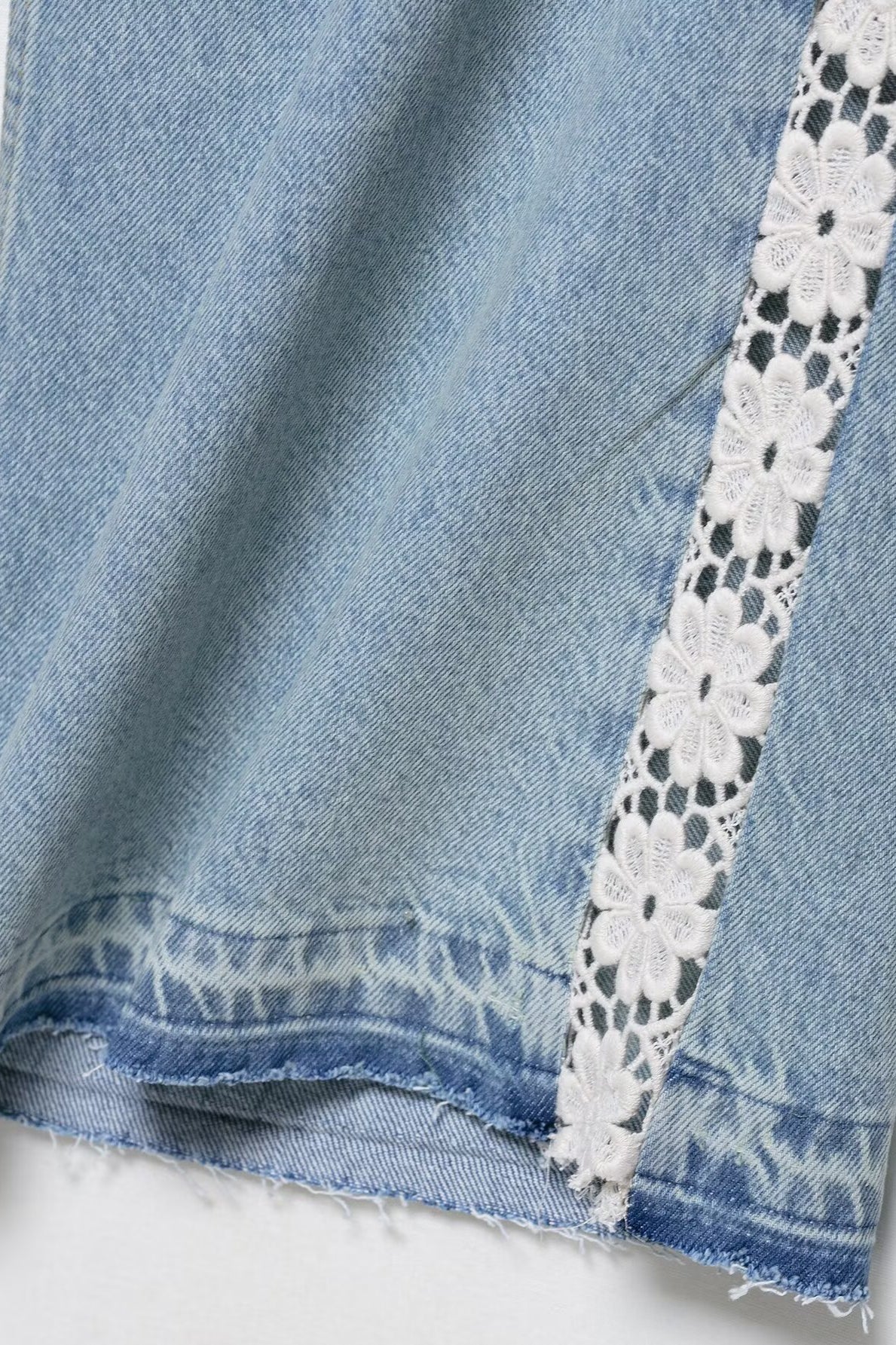 High waist wide leg denim shorts with white lace trim and frayed edges