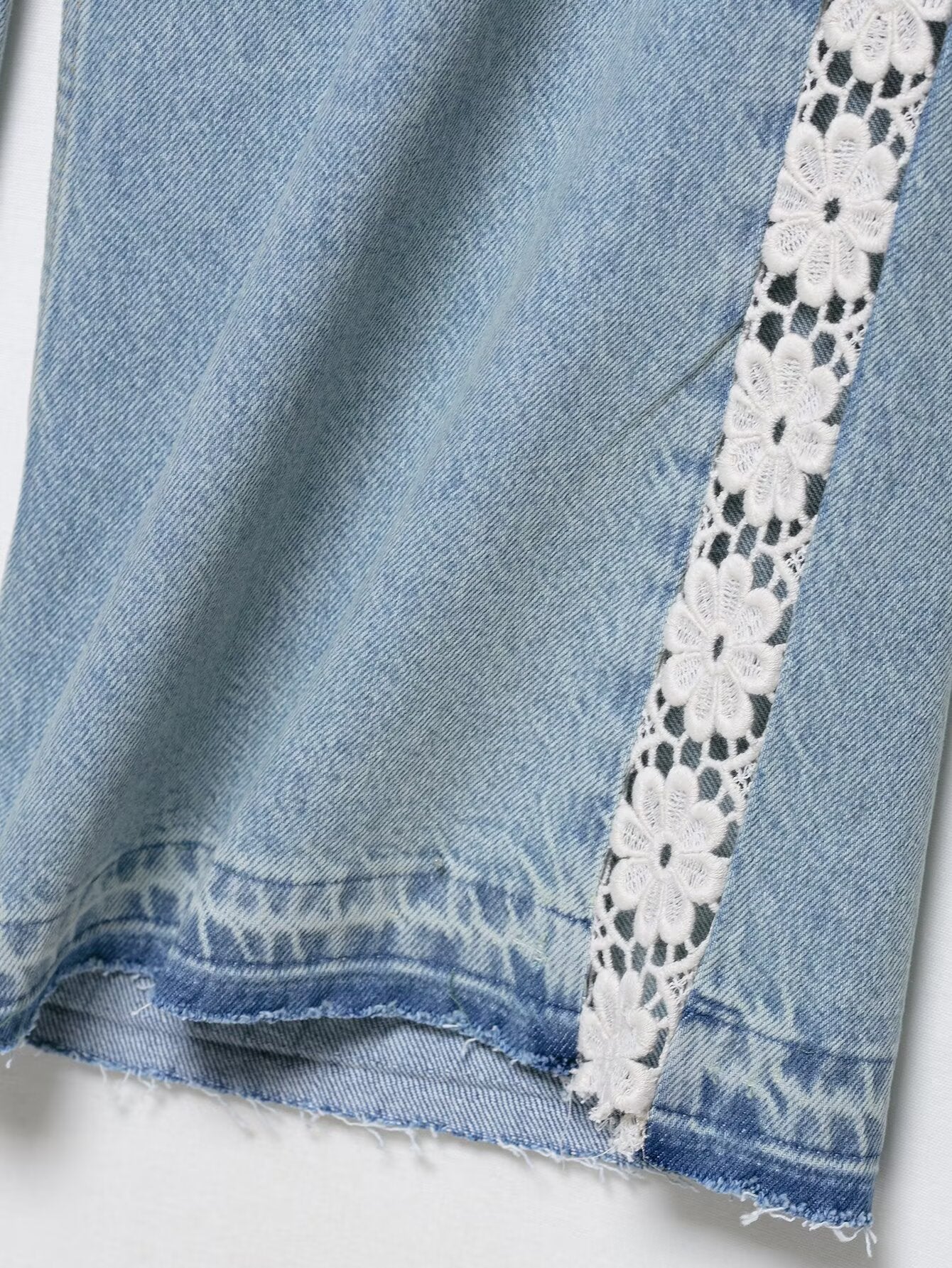 High waist wide leg denim shorts with white lace trim and frayed edges