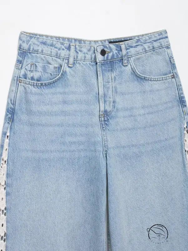 High waist wide leg jeans in light blue denim with crochet stitching and patches