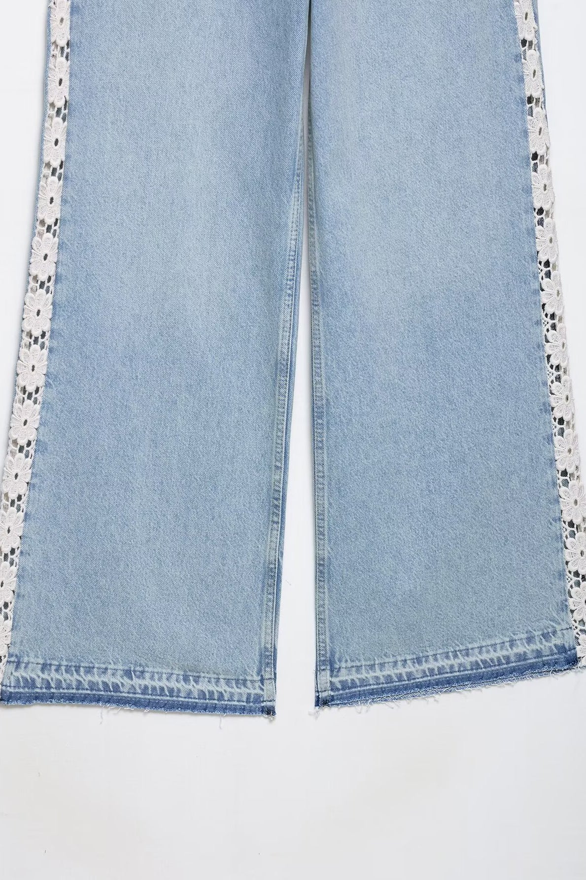 Light blue Zara wide leg jeans with white lace trim and crochet stitching