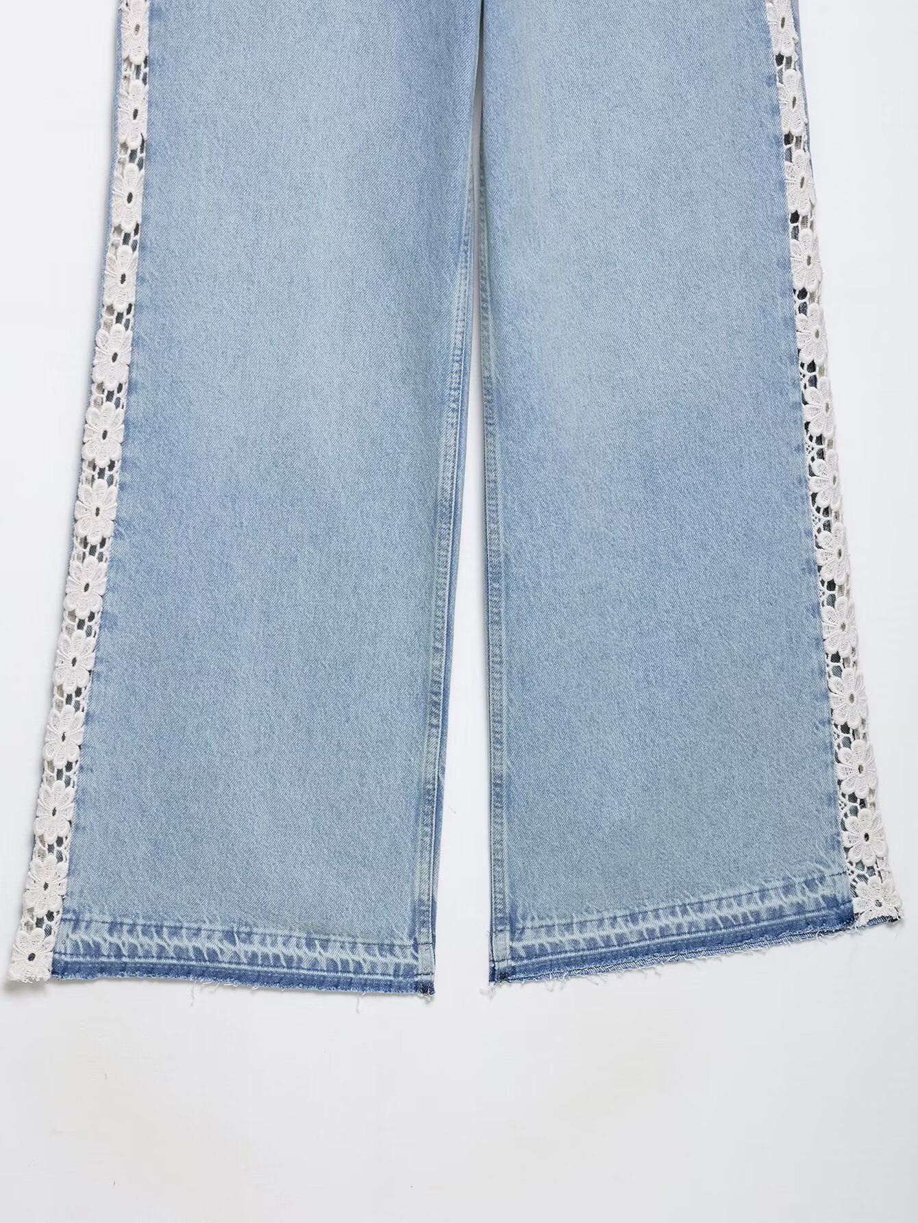 Light blue Zara wide leg jeans with white lace trim and crochet stitching
