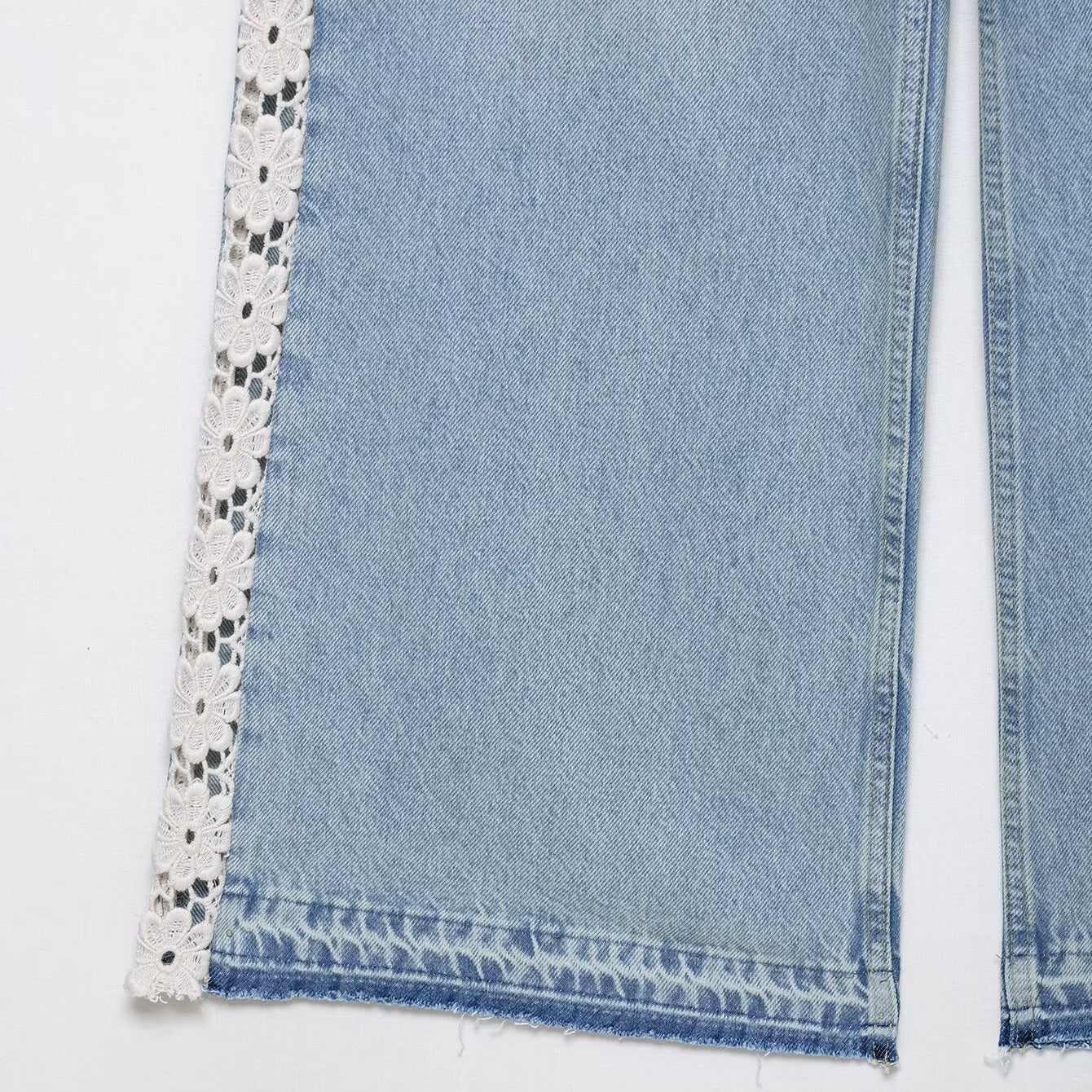 Light blue wide leg jeans with lace trim and black polka dots