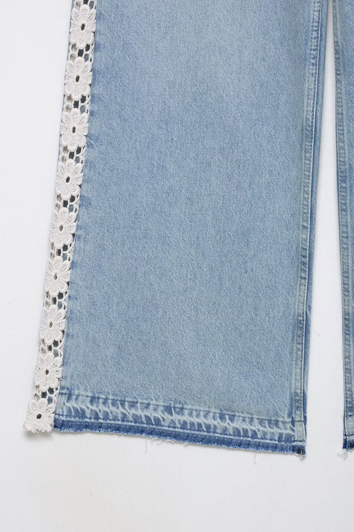 Light blue wide leg jeans with lace trim and black polka dots