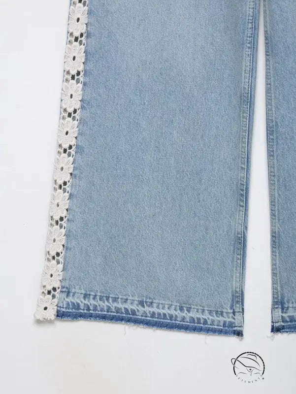 High waist wide leg jeans in light blue denim with crochet lace trim and black polka dots
