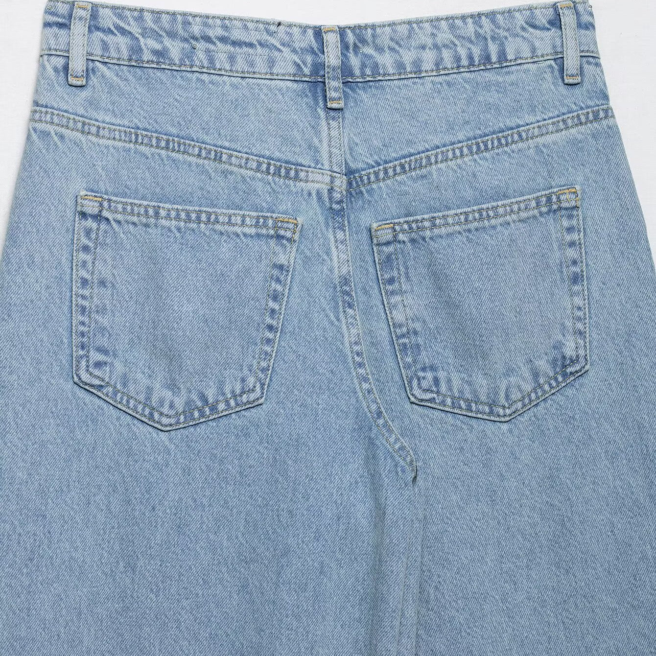 Light blue wide leg jeans with crochet stitching and high waist design