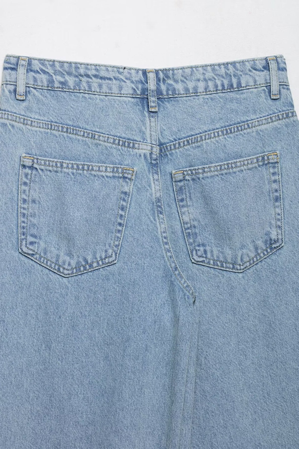 Light blue wide leg jeans with crochet stitching and high waist design