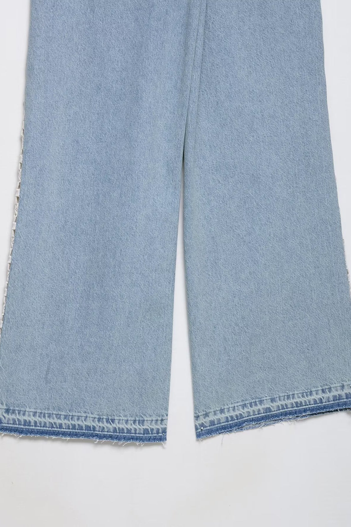Light blue wide leg Langry fashion jeans with frayed hem and crochet stitching
