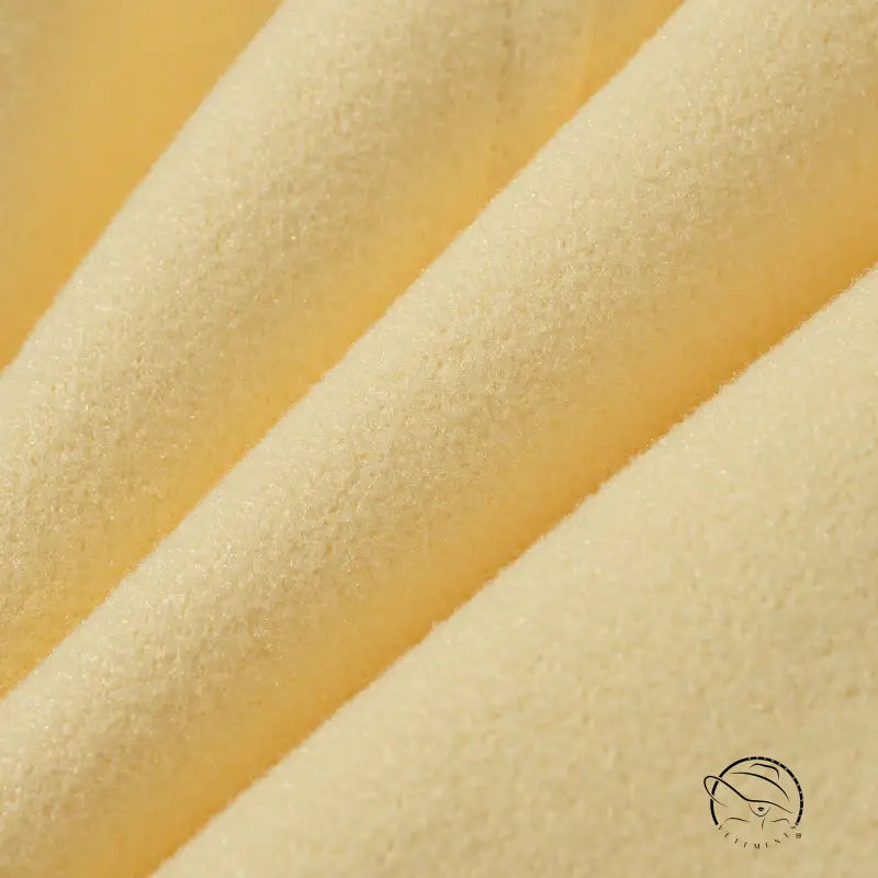 Cream-colored textured langry fashion cushion in gorgeous short woolen coat