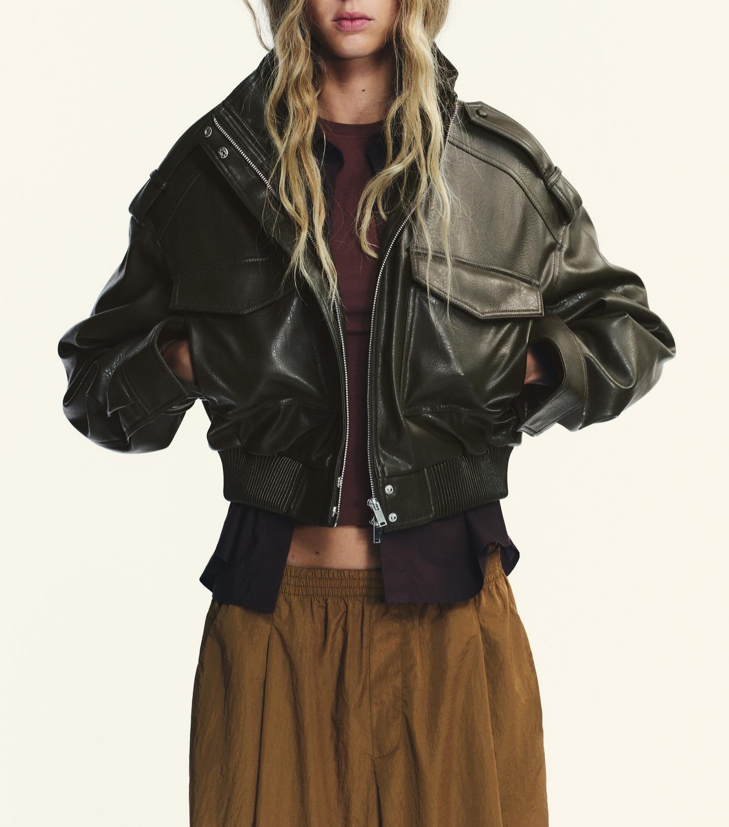 Black faux leather bomber jacket with polo collar and zipper details