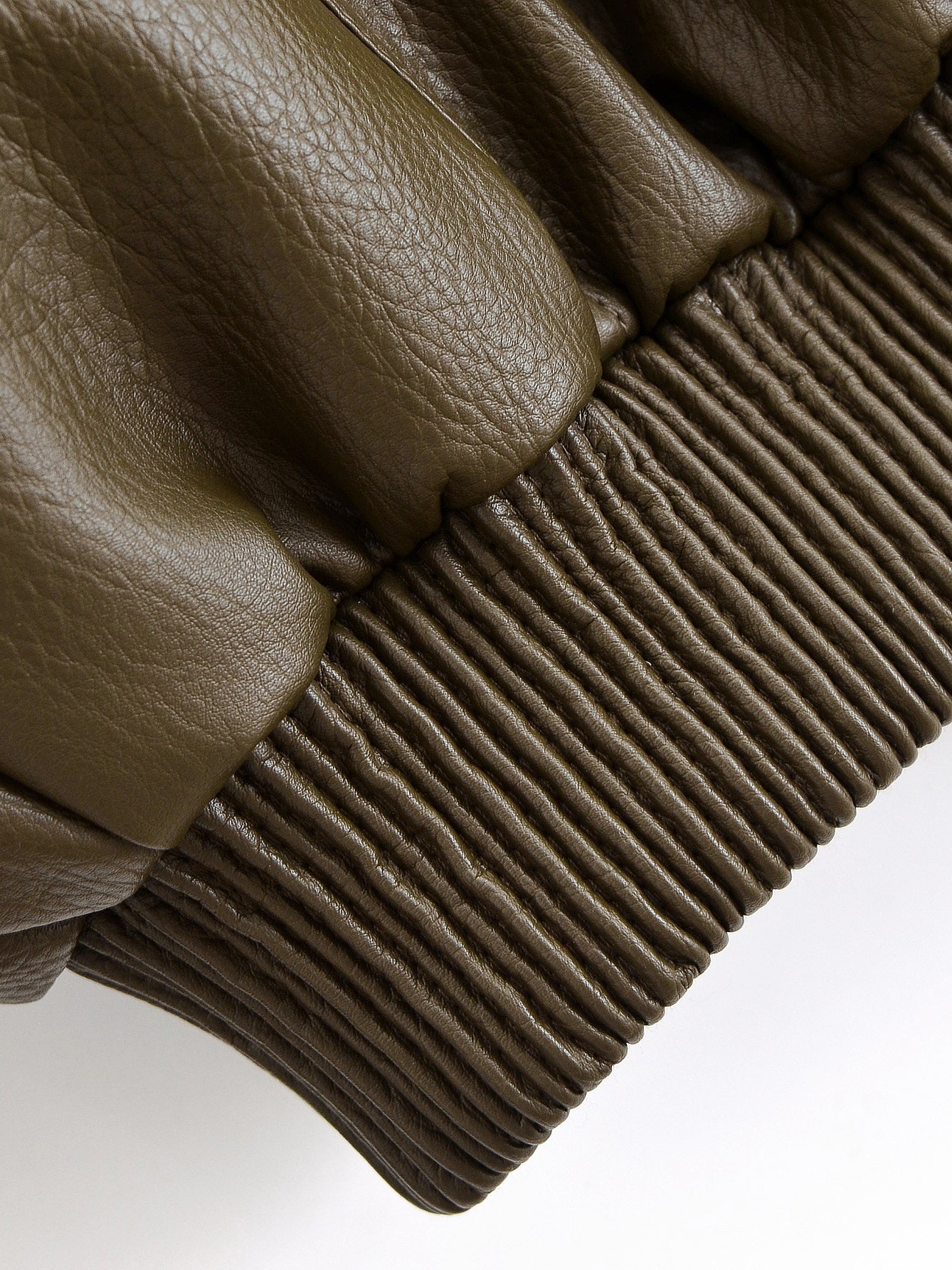Olive green faux leather gloves with ribbed wrist and textured palm