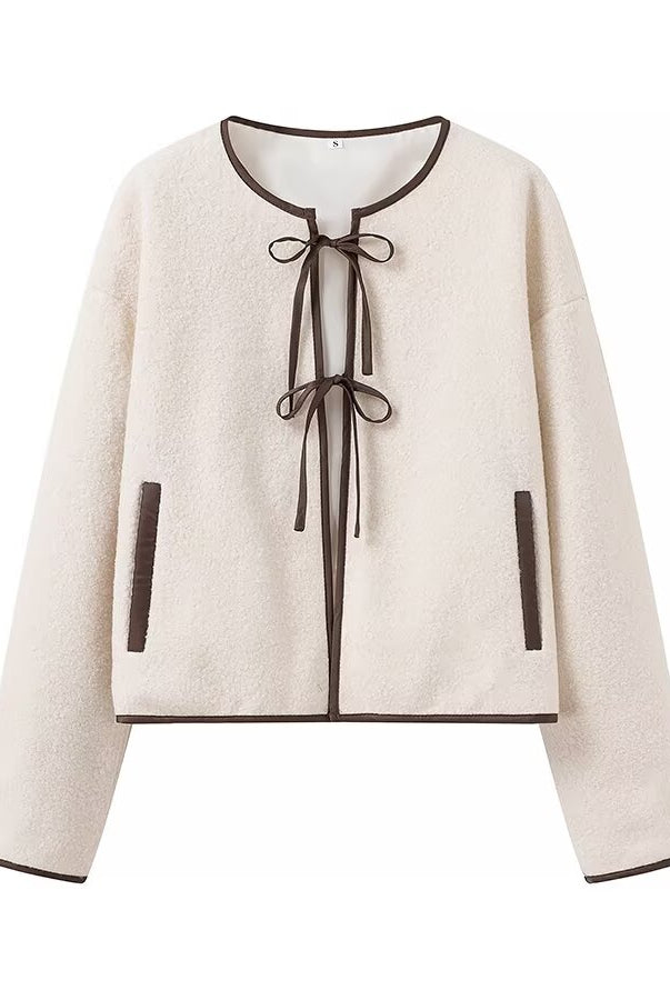 Cozy langry fashion cream sweater with black trim and lace-up front