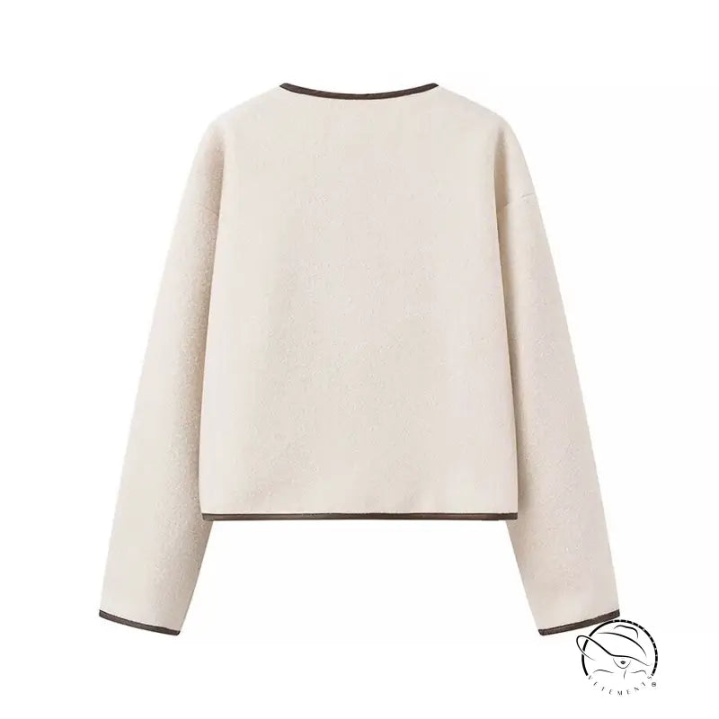 Cozy lace cream-colored cropped sweater with black trim