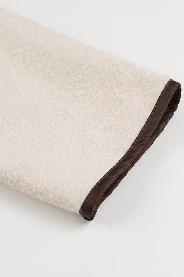 Beige and brown textured towel with dark trim in Langry cozy fashion coat