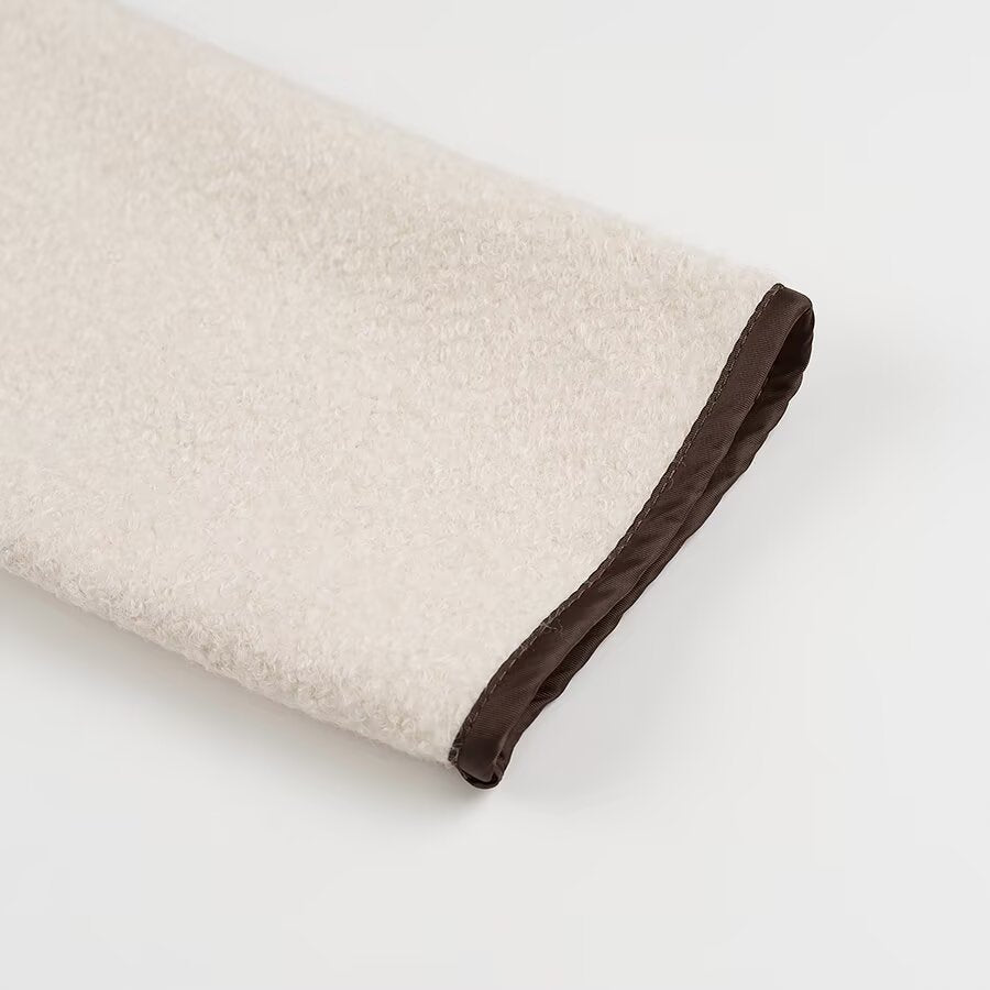 Beige and brown textured towel with dark trim in Langry cozy fashion coat