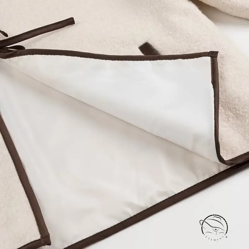 Cozy lace up coat with white and brown trim zippered pouch