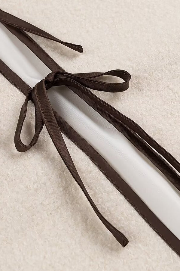 Brown leather shoelaces with bow tie design on Langry fashion coat