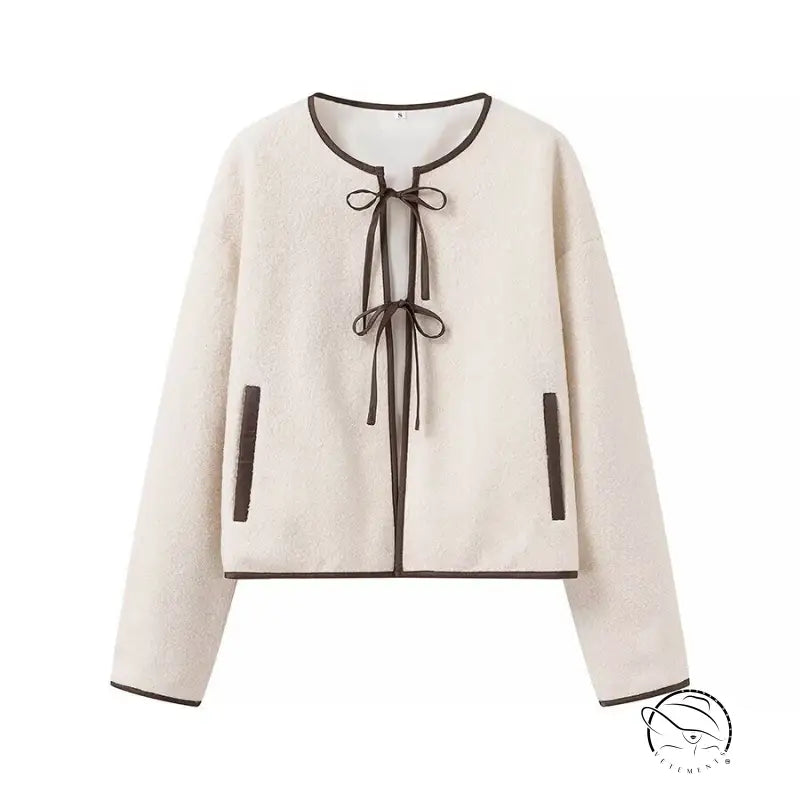 Cozy lace up cream sweater with black trim in Langry fashion