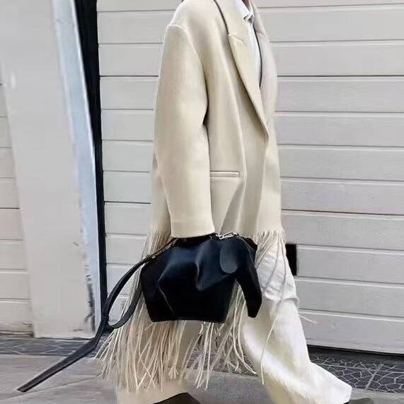 Langry fashion cream fringe mid-length tassel trench coat with black leather bag and brown boots