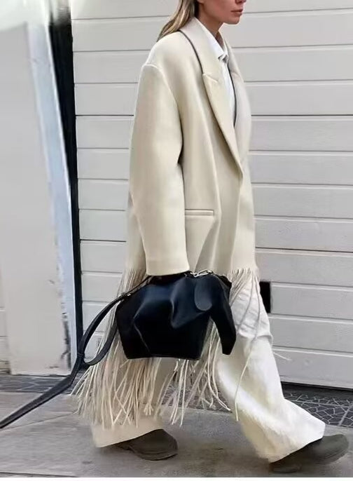 Langry fashion cream fringe mid-length tassel trench coat with black leather bag and brown boots