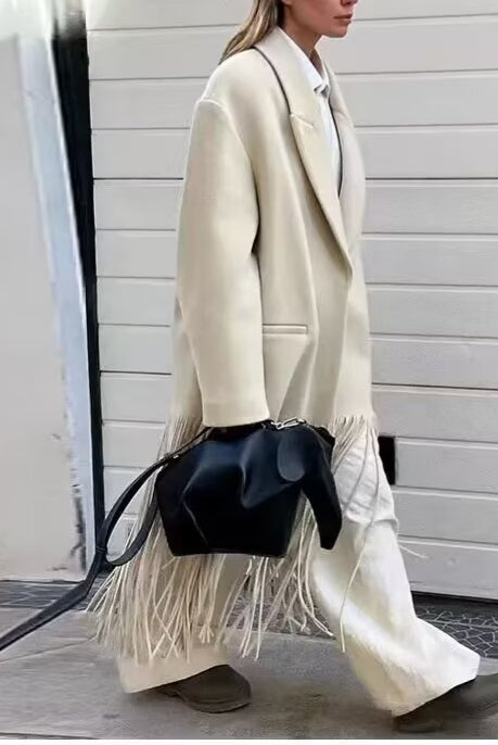 Langry fashion cream fringe mid-length tassel trench coat with black leather bag and brown boots