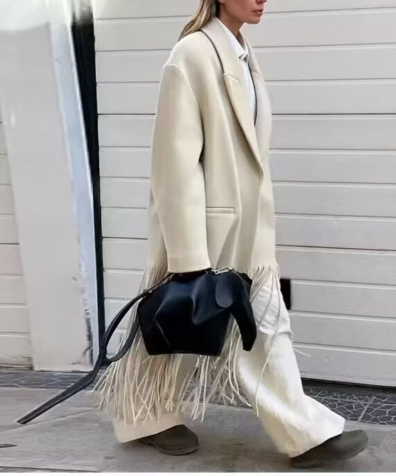 Langry fashion cream fringe mid-length tassel trench coat with black leather bag and brown boots