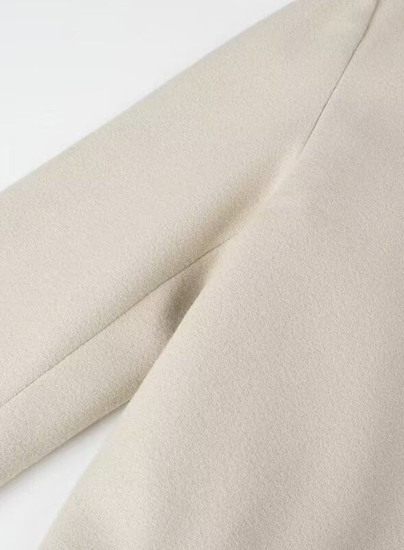 Cream-colored langry fashion trench coat fabric with subtle texture