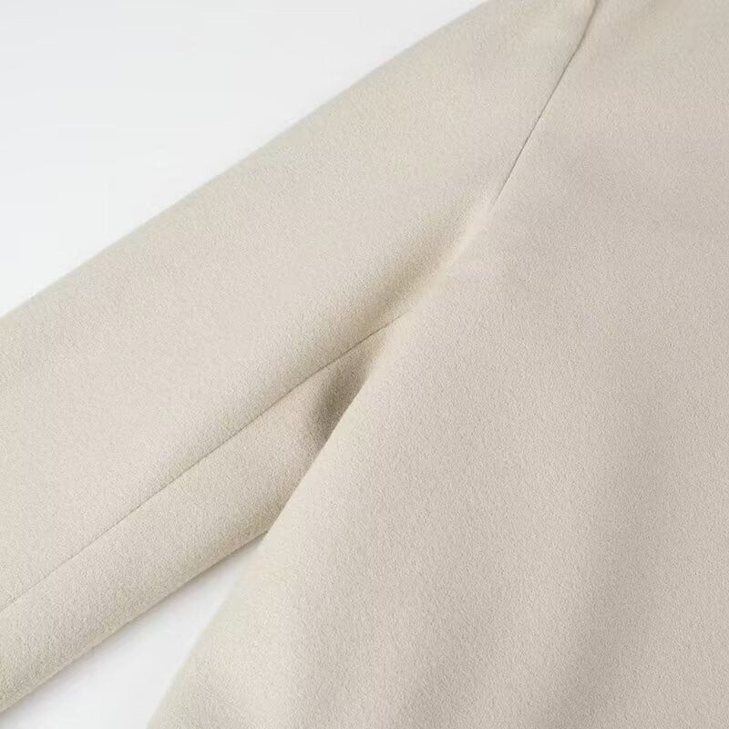 Cream-colored langry fashion trench coat fabric with subtle texture