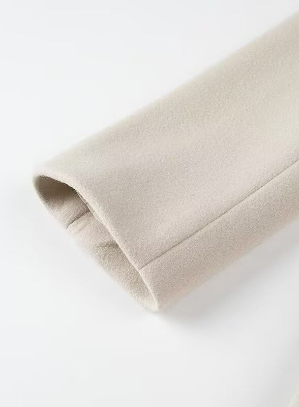 Beige fleece-lined arm warmer with elastic cuffs in Langry fashion trench coat