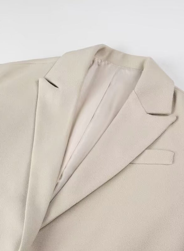 Langry fashion beige wool suit jacket with lapels, pockets, and tassel details