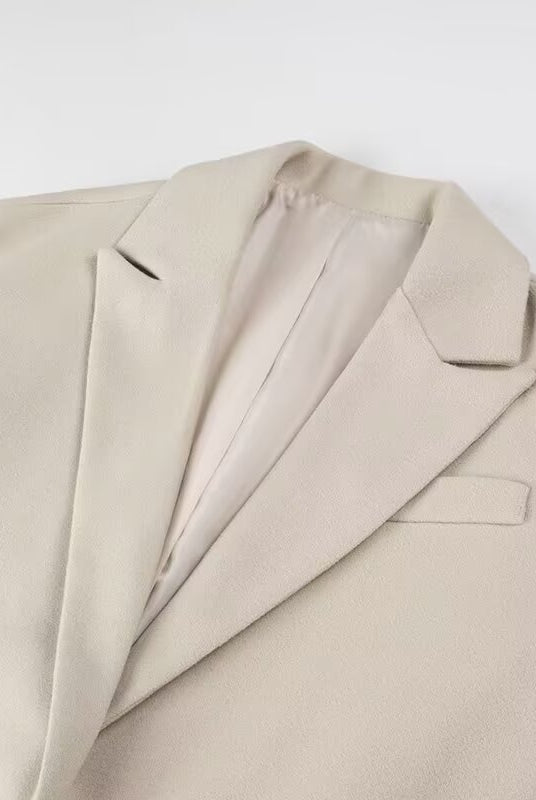 Langry fashion beige wool suit jacket with lapels, pockets, and tassel details