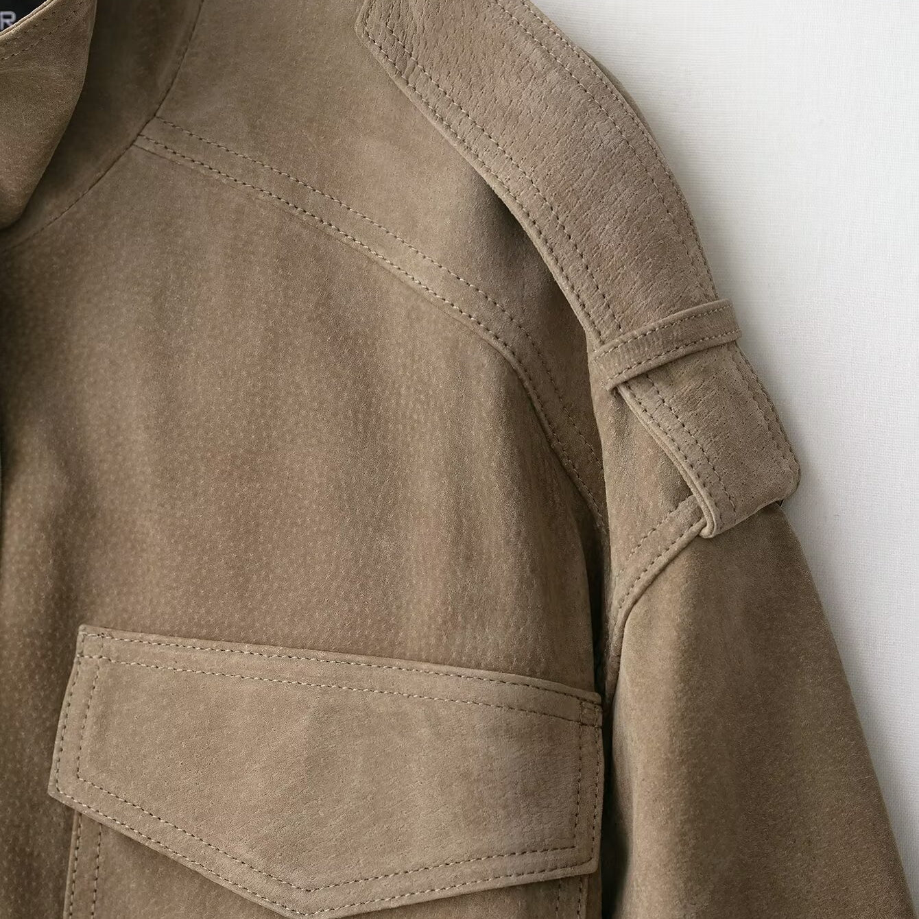 Elegant beige suede textured leather coat with large pockets and button closure in Langry fashion ملابس