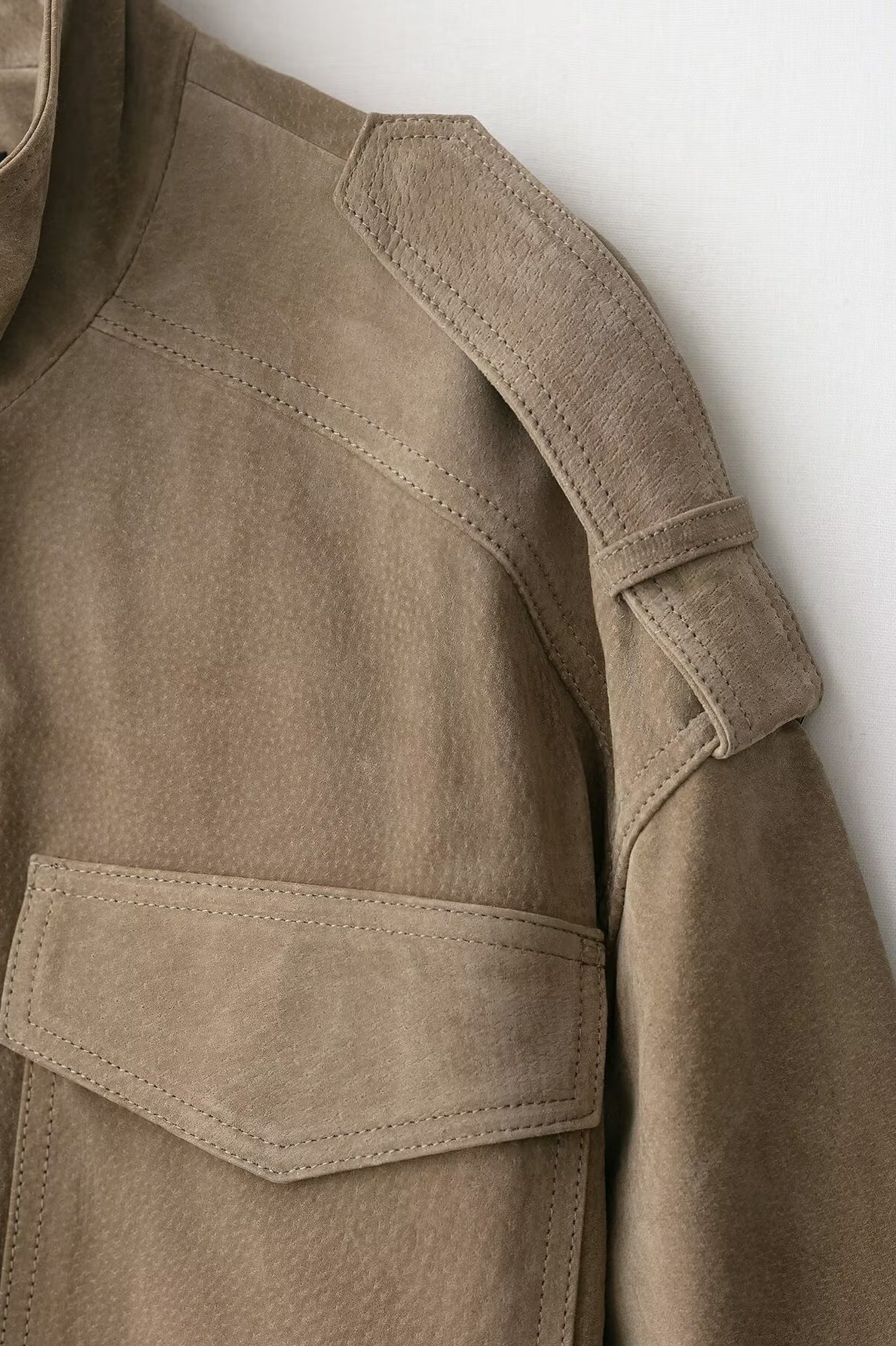 Elegant beige suede textured leather coat with large pockets and button closure in Langry fashion ملابس