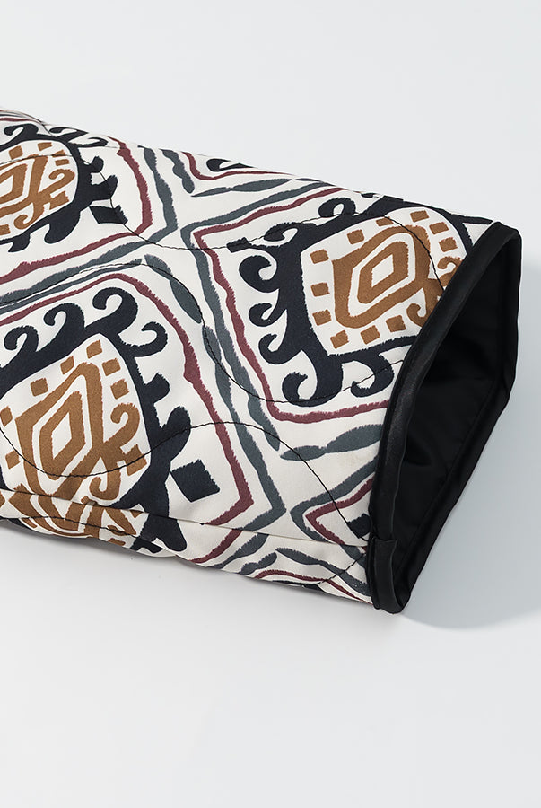 Rolled black and white patterned yoga mat with brown accents, langry fashion apparel