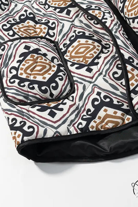 Black and white patterned sleeping bag with brown accents in Langry fashion coat