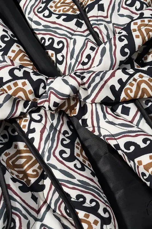 Langry fashion black and white quilted coat with brown accents