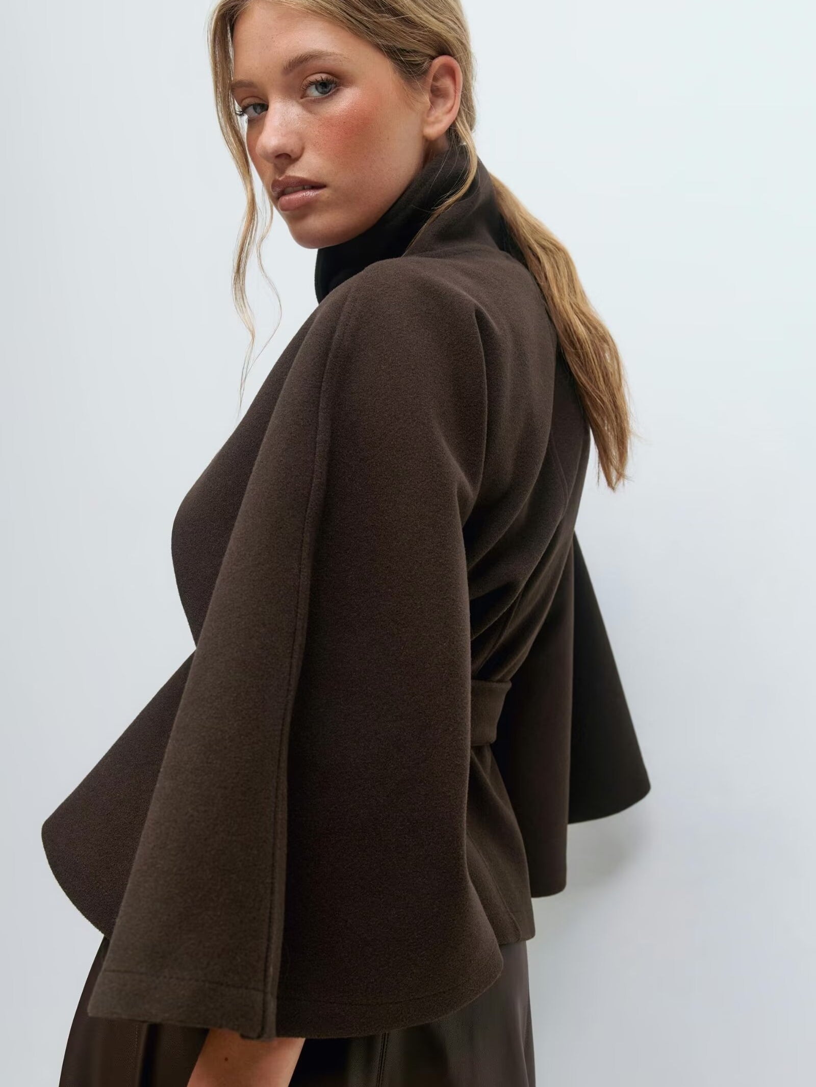 Graceful Langry fashion brown woolen cape coat with black turtleneck and layered skirt
