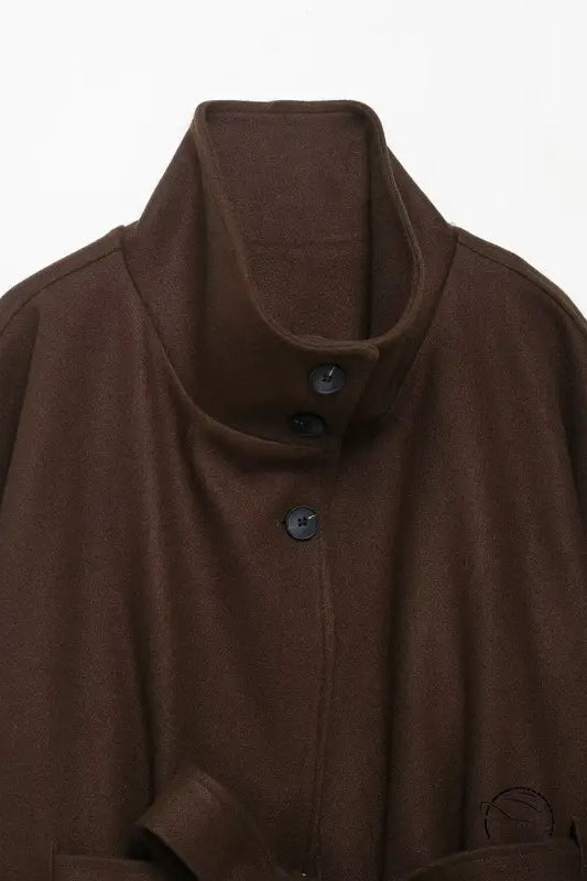 Brown woolen cape coat with high collar and button closure