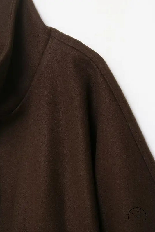 Graceful woolen cape coat with brown turtleneck sweater