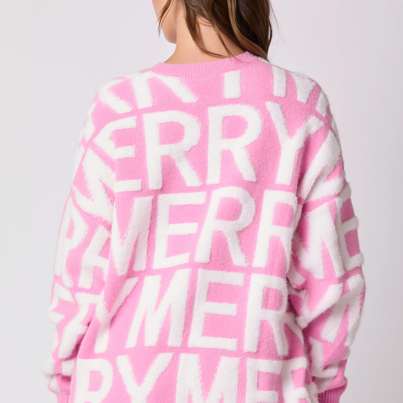 Pink oversized langry fashion sweater with merry graphic on back