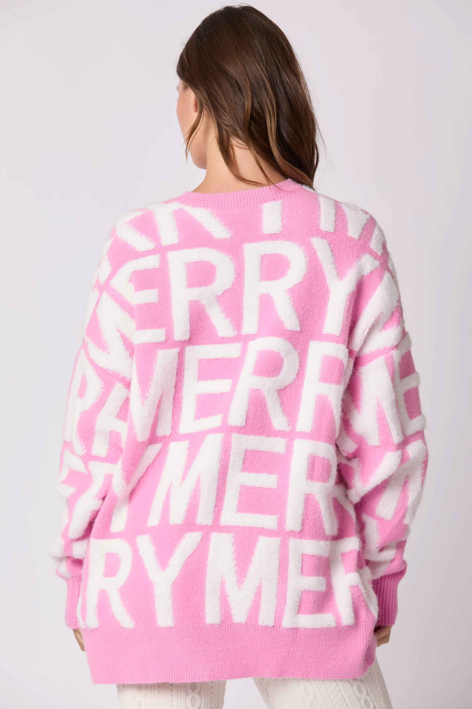 Pink oversized langry fashion sweater with merry graphic on back