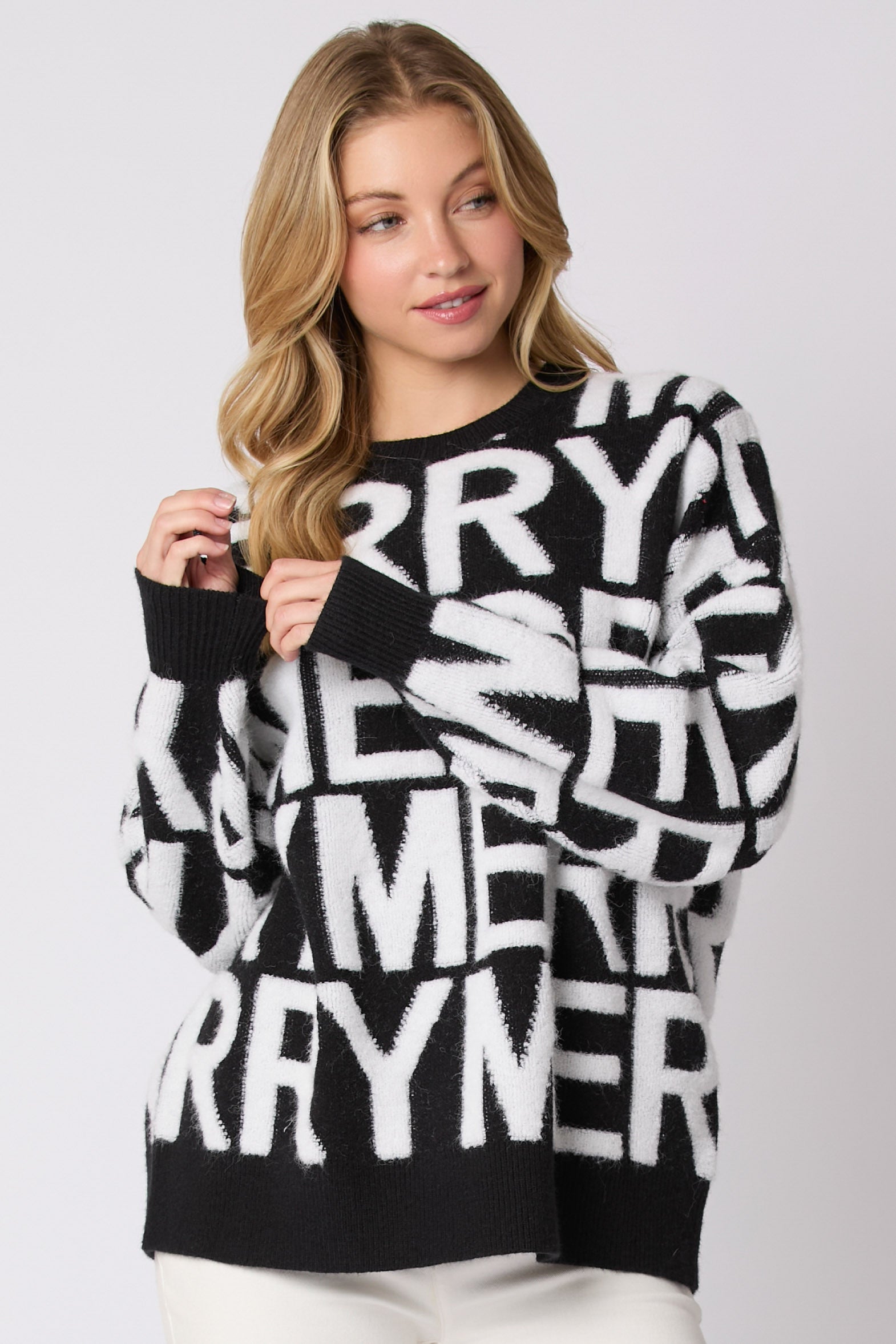 Black and white oversized langry fashion sweater with bold lettering