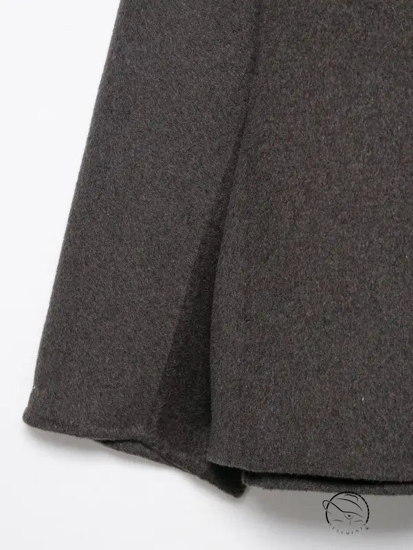 Charcoal gray wool skirt with subtle pleats in fur effect neckline coat