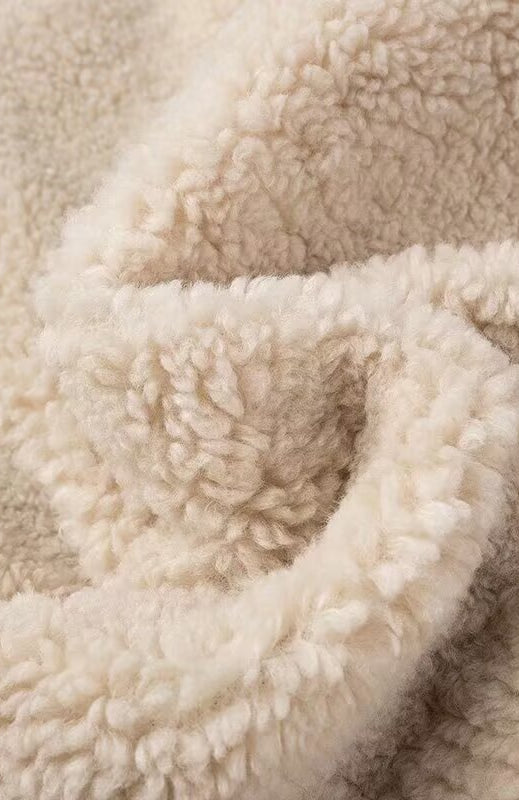 Cream-colored sherpa blanket in Langry fashion furry coat with polo collar