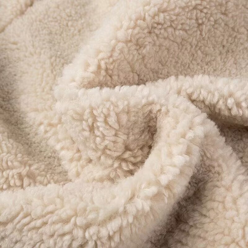 Cream-colored sherpa blanket in Langry fashion furry coat with polo collar