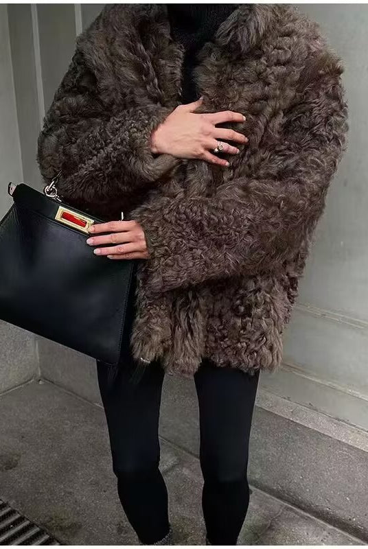 Casual Langry big fur terry coat in brown with black leather handbag and red tag